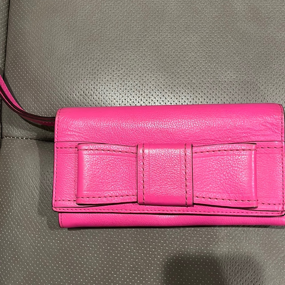 Kate Spade wallet (pink) gently used. May be used as a wallet or a wristlet.